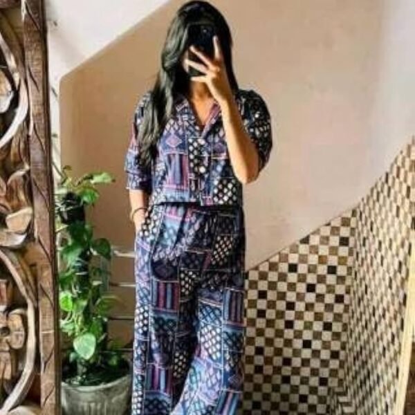 A stylish printed cord set featuring a half-sleeve shirt with a matching pair of wide-leg pants, perfect for casual and chic looks.